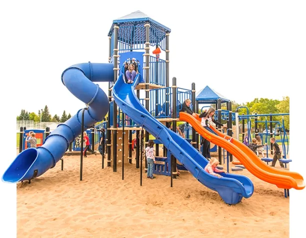 Children sliding down blue and orange slides in a sand-based playground.