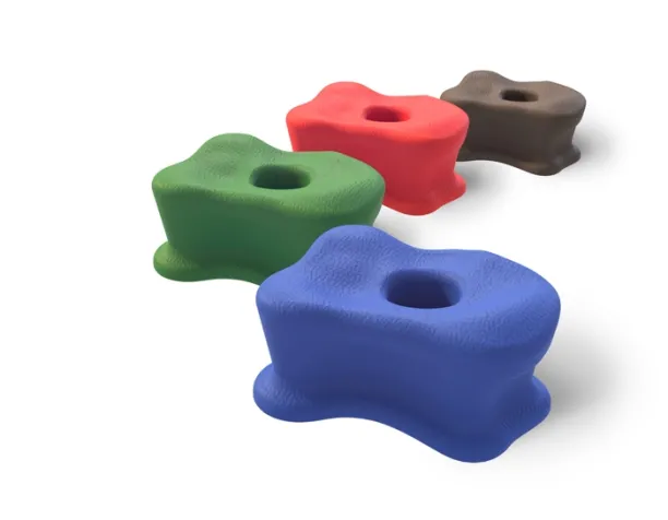 Assorted red, green, blue, and brown playground stepping stones with textured surface.