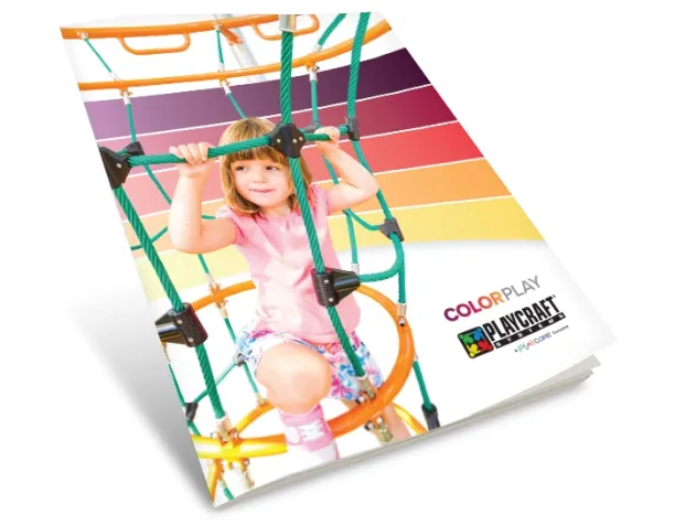 Child climbing on a rope net with colorful stripes in the background.