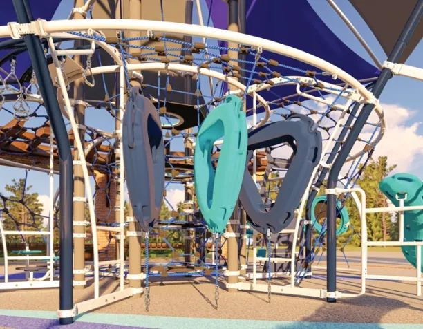 Rope climbing structure with blue and teal rings under a large shade canopy.