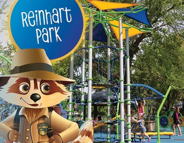Cartoon raccoon character with adventure outfit in front of playground featuring rope climbing structure and shade canopies.