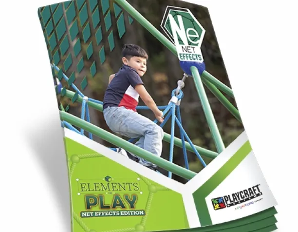 Young child climbing on a blue and green rope net structure.