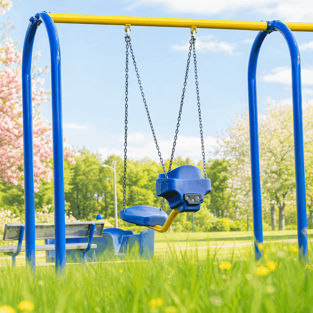 Playshare swing with blue and yellow posts
